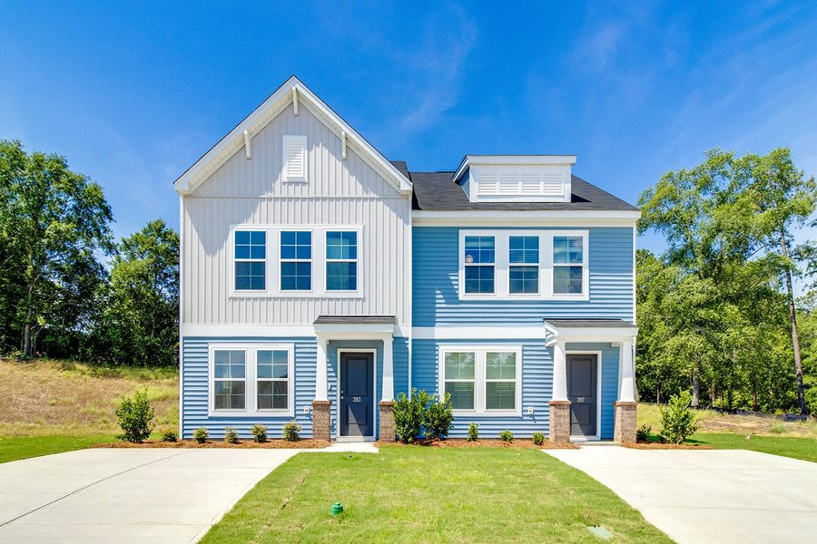Front exterior of a new home in Padgett Commons, Hopkins, SC, highlighting curb appeal (Image 2). Front exterior of a new home in Padgett Commons, Hopkins, SC, highlighting curb appeal (Image 2).