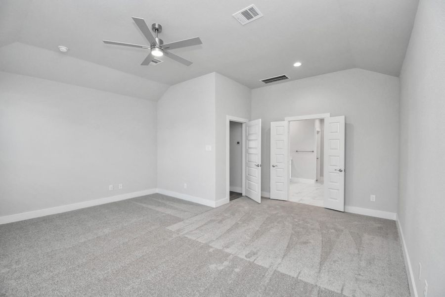 Come and unwind after a long day in this magnificent primary suite! This spacious room features plush carpet, warm paint, high ceilings and large windows with privacy blinds.