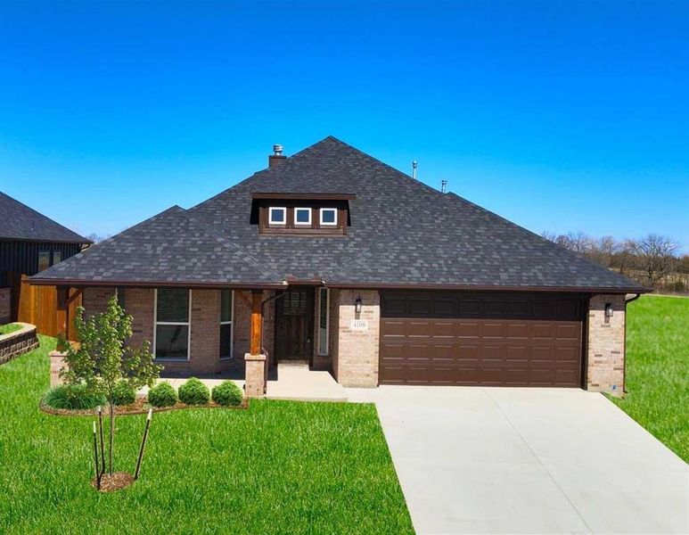 Front exterior of a new home in The Preserve At Country Ridge, Sherman, TX, highlighting curb appeal (Image 1). Front exterior of a new home in The Preserve At Country Ridge, Sherman, TX, highlighting curb appeal (Image 1).