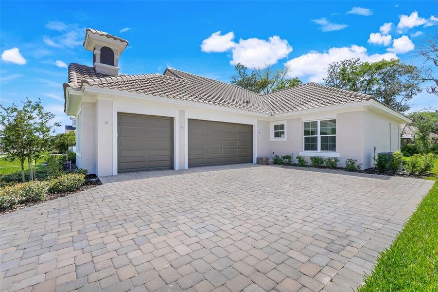 Front exterior of a new home in Toscana, Palm Coast, FL, highlighting curb appeal (Image 21).