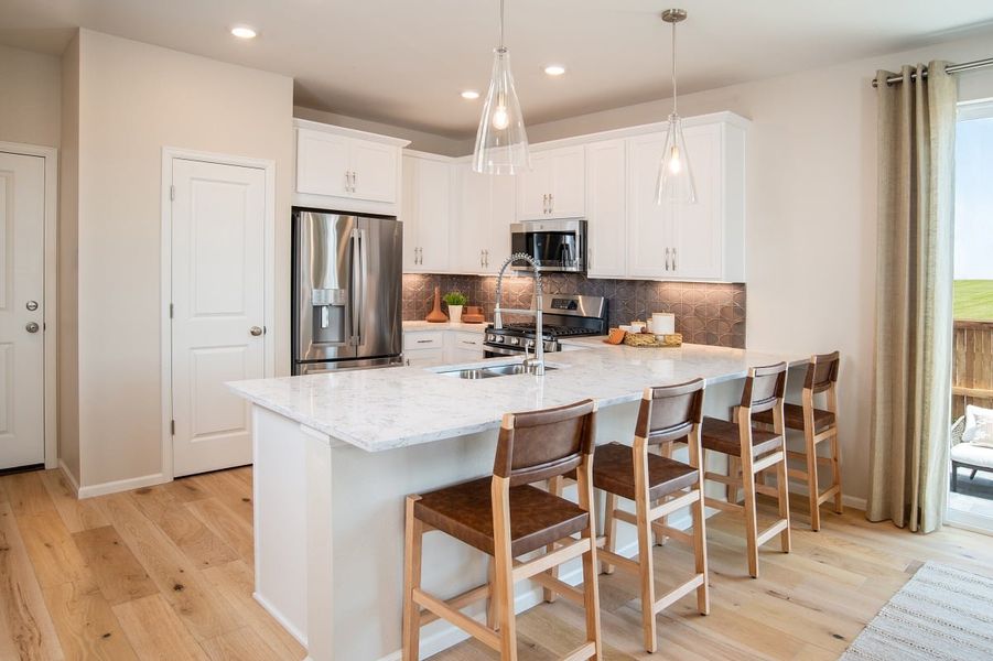 Representative furnished interior of a home built from the 1469 by KB Home in Windler Midtown Villas, Aurora (Image 3).