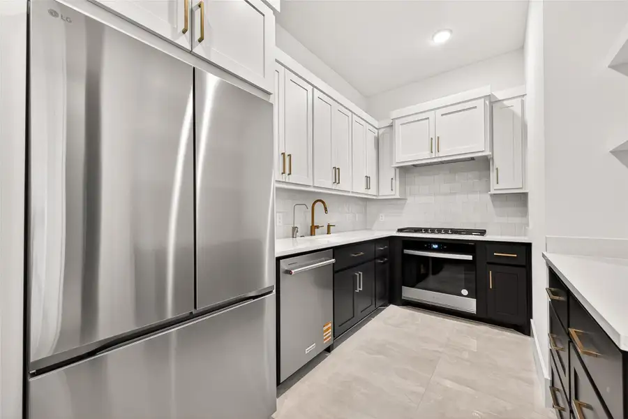 Spice Kitchen: Tucked discreetly behind the main kitchen is the fully equipped spice kitchen and pantry, the perfect hidden gem for preparing elaborate meals while keeping the main entertaining space pristine. Complete with its own refrigerator, sink, oven, stove, generous countertops, and abundant cabinetry for pantry items, this secondary kitchen offers incredible convenience for entertaining.