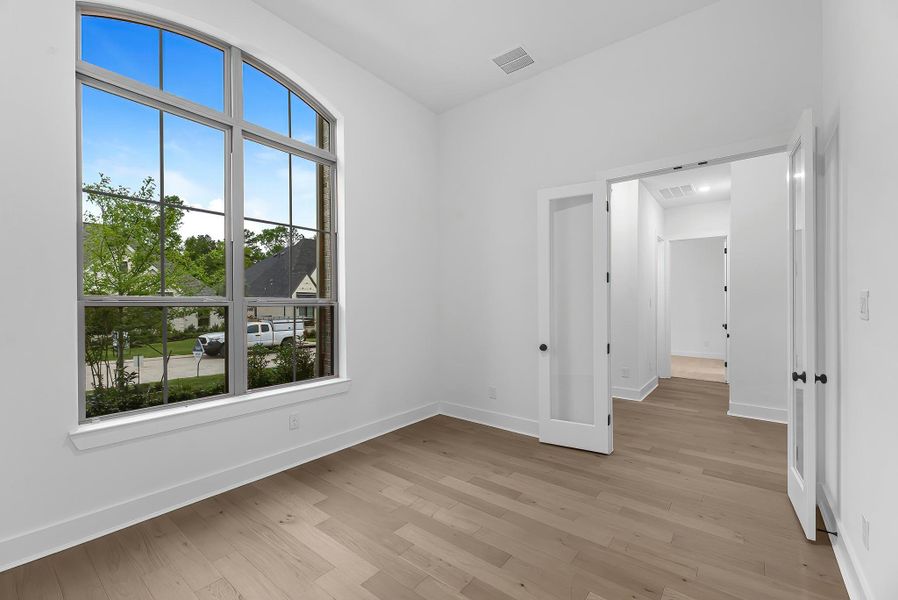 The private home office is located at the front of the home and features double French doors. The private home office is located at the front of the home and features double French doors.