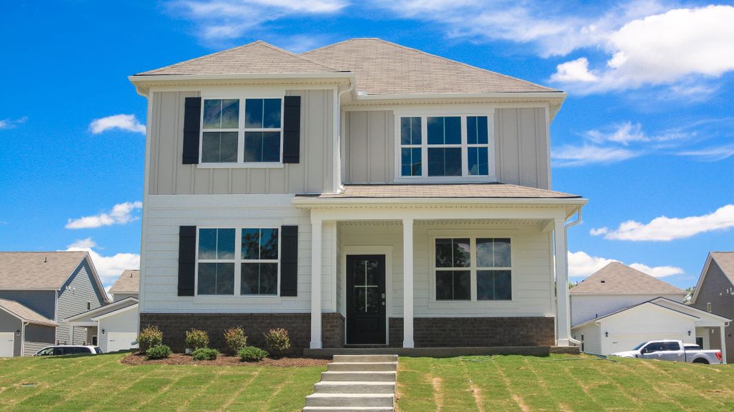 Front exterior of a new home in Reserve at Hickory Ridge, Columbia, TN, highlighting curb appeal (Image 20).
