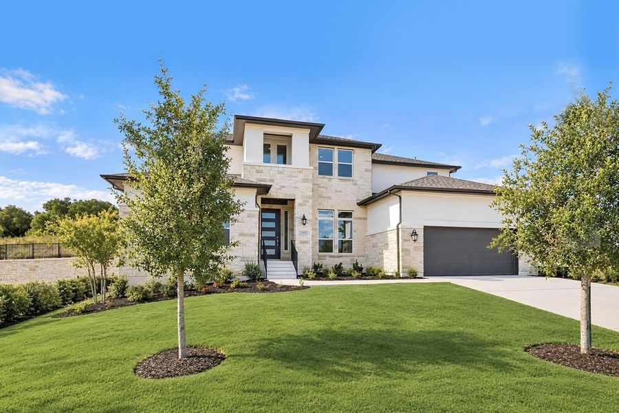 Front exterior of a new home in Travisso, Leander, TX, highlighting curb appeal (Image 13).