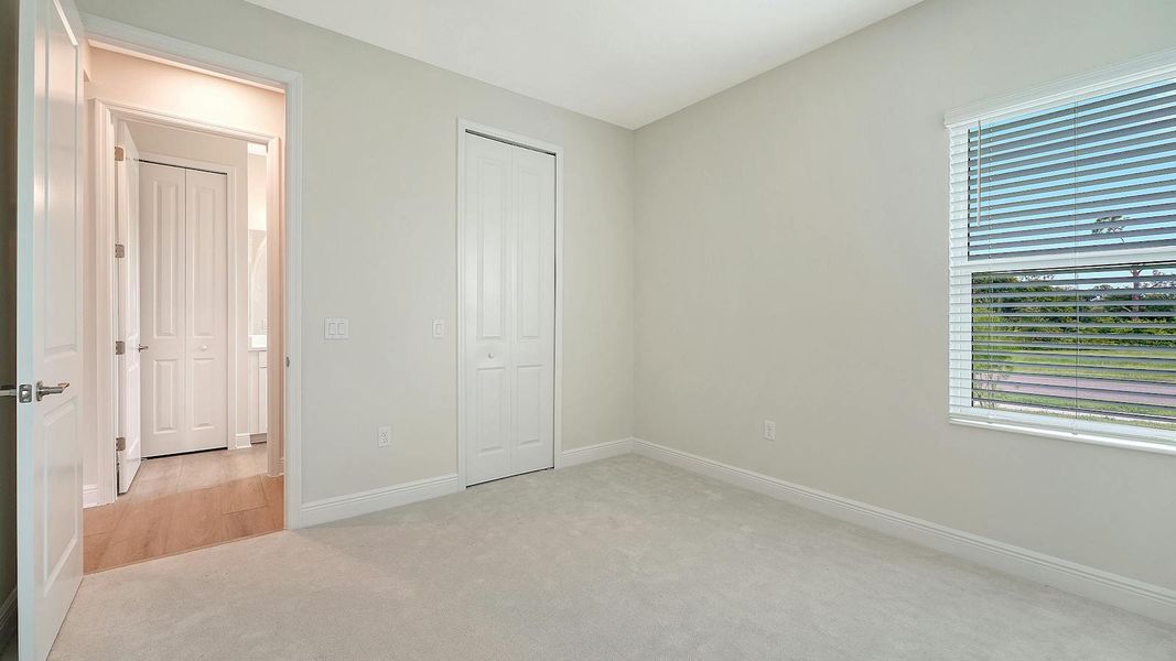 Spacious, unfurnished interior of a new home in Wildleaf Real Estate and Homes for Sale in Parrish, FL - Neal Communities, Parrish (Image 32).