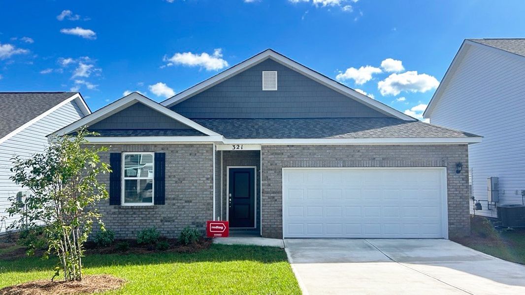 Front exterior of a new home in Hunter's Branch, Hopkins, SC, highlighting curb appeal (Image 1).