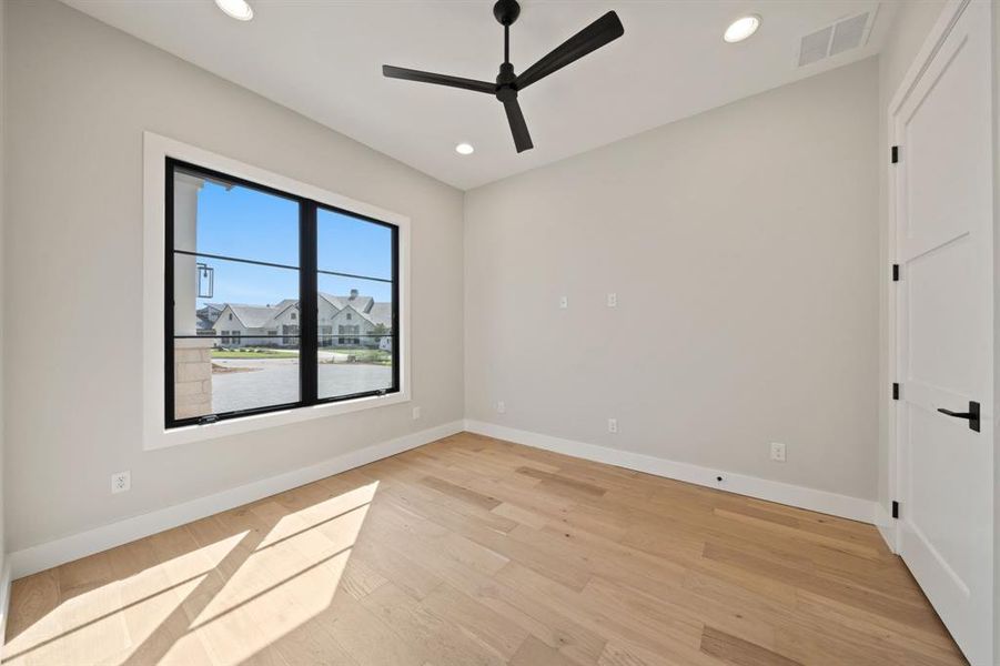 Office toward the front of the home with large closet with shelves.