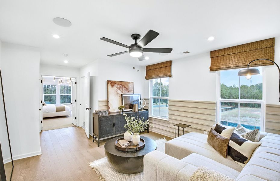 Furnished interior in a model home at Ansley Towns in Cumming (Image 10).