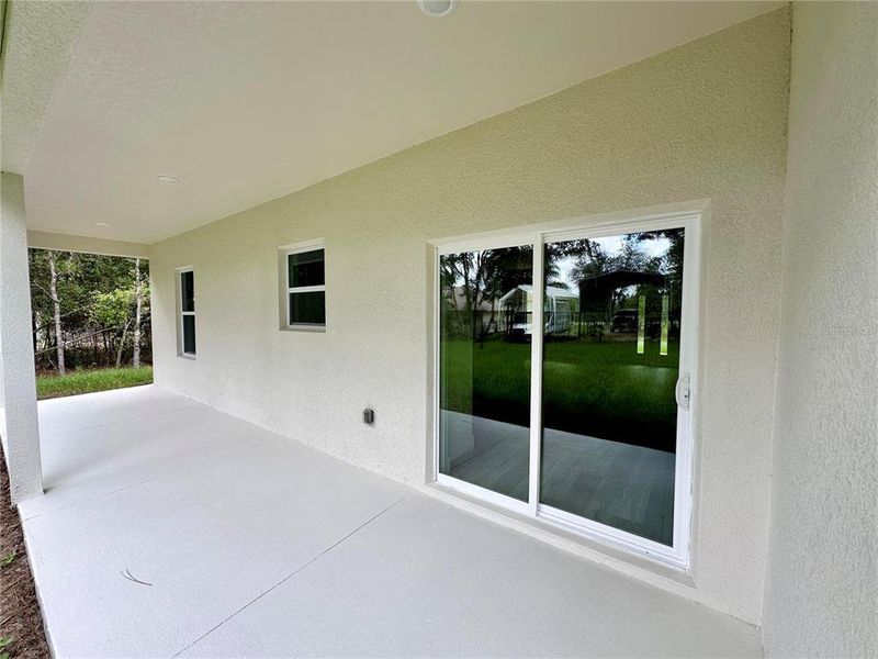 Exterior details and patio area of a home in , Citrus Springs (Image 18).