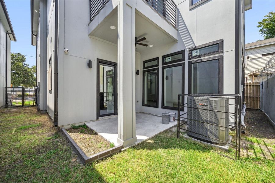 Enjoy a covered patio just off the main living area, complete with a ceiling fan for comfort in warmer months. The adjoining yard adds flexibility for gardening, pets, or simple outdoor relaxation.