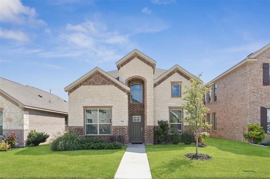 Front exterior of a new home in Wildflower Ranch: Lonestar Collection, Fort Worth, TX, highlighting curb appeal (Image 2). Front exterior of a new home in Wildflower Ranch: Lonestar Collection, Fort Worth, TX, highlighting curb appeal (Image 2).