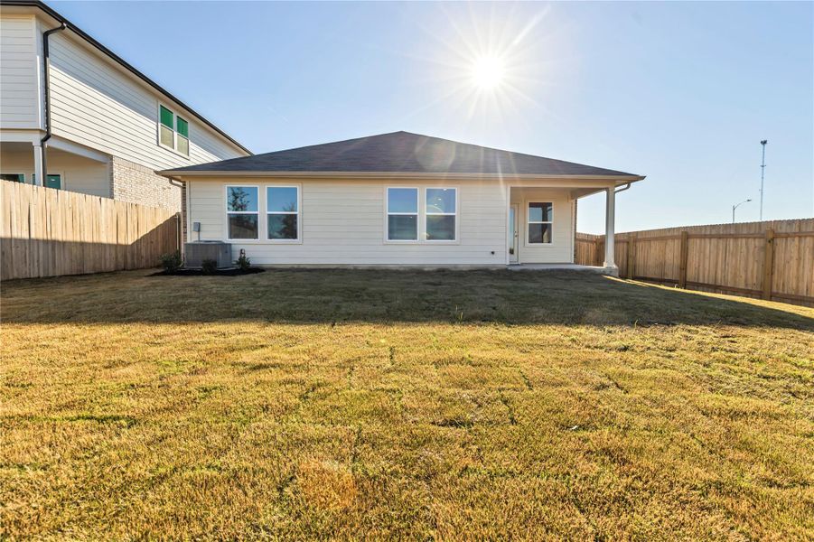 Front exterior of a new home in Carillon, Manor, TX, highlighting curb appeal (Image 22). Front exterior of a new home in Carillon, Manor, TX, highlighting curb appeal (Image 22).