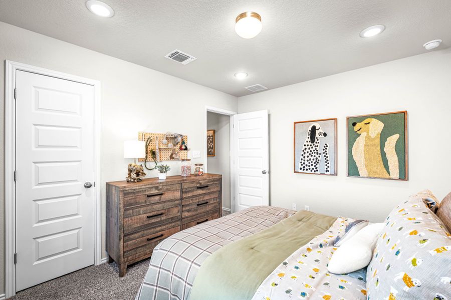 These are the secondary bedrooms of the Hawkins plan and is the model home in Carillon at 13305 Eppright Trace Blvd., Manor, TX. These are the secondary bedrooms of the Hawkins plan and is the model home in Carillon at 13305 Eppright Trace Blvd., Manor, TX.