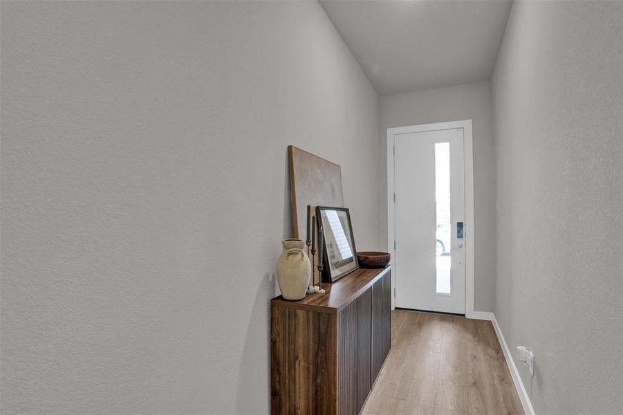 Step into a thoughtfully designed entry that feels both calm and elevated, offering a natural pause before the home opens into its main living spaces. Step into a thoughtfully designed entry that feels both calm and elevated, offering a natural pause before the home opens into its main living spaces.