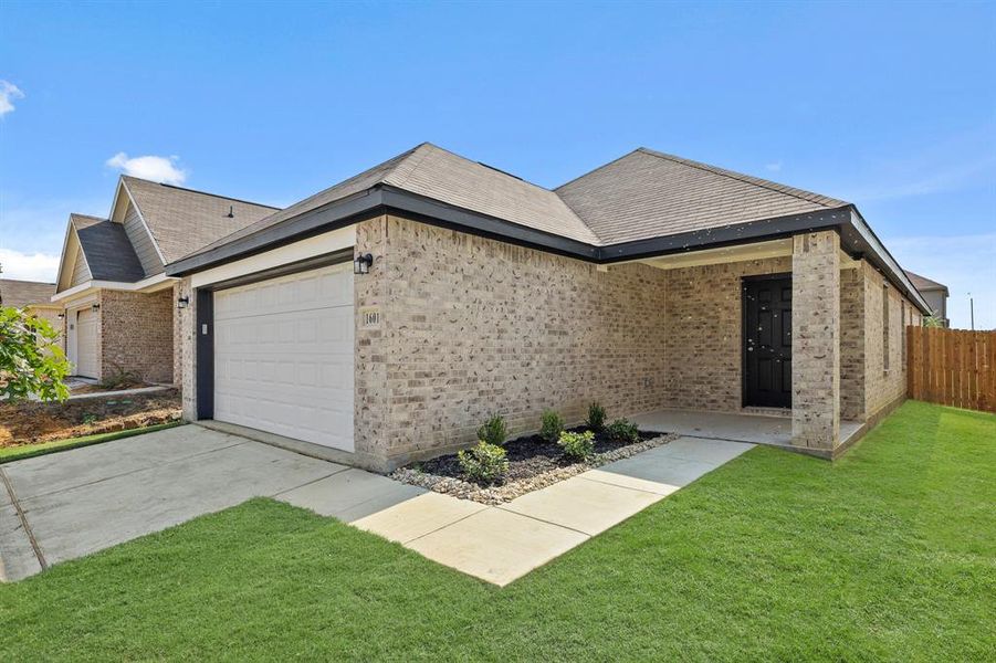 Front exterior of a new home in Christian Meadows, Ennis, TX, highlighting curb appeal (Image 1). Front exterior of a new home in Christian Meadows, Ennis, TX, highlighting curb appeal (Image 1).