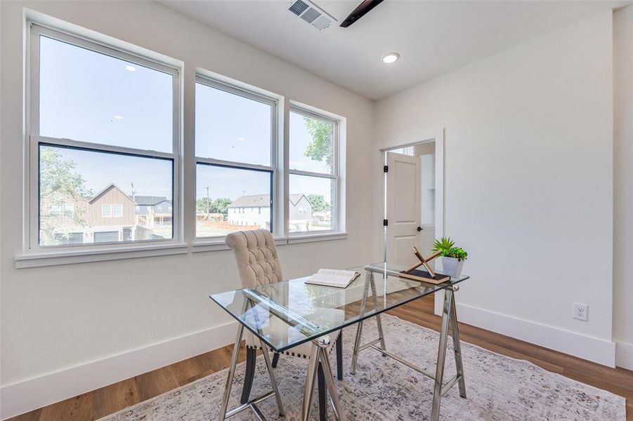 Home office featuring wood finished floors and recessed lighting Home office featuring wood finished floors and recessed lighting