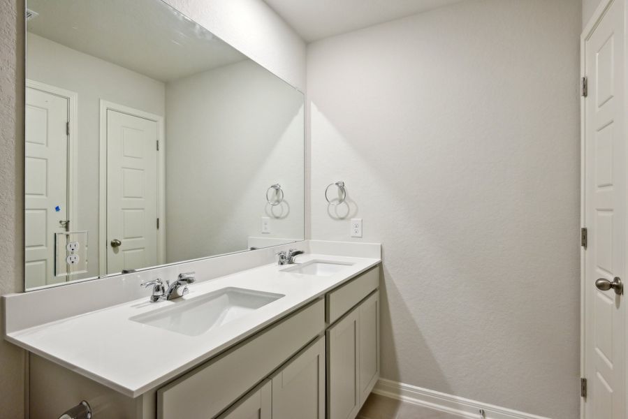 Guest bedroom in the Red River floorplan at a Meritage Homes community.