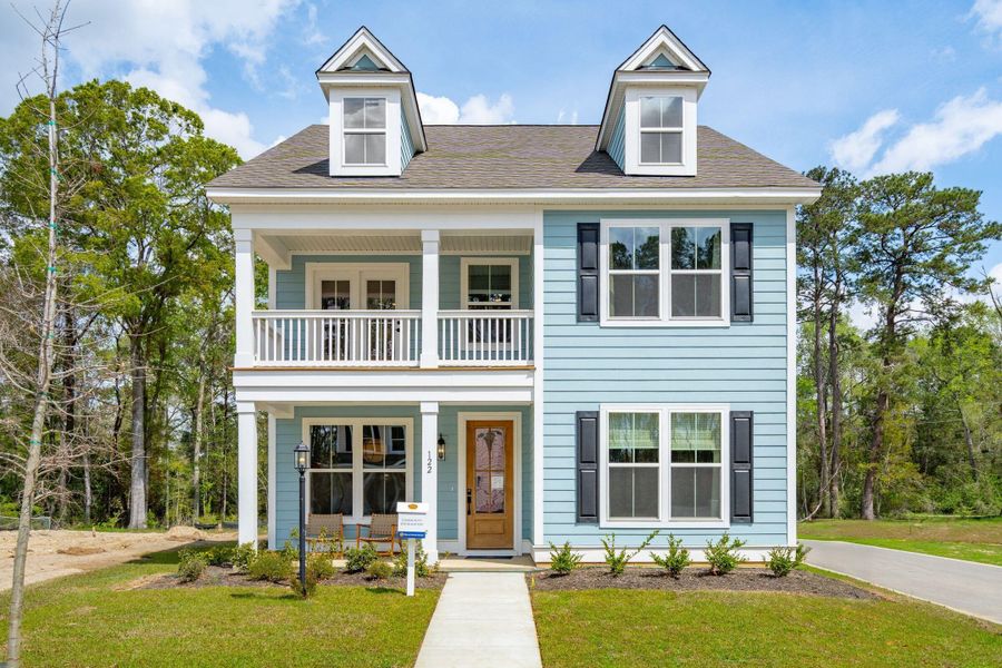 Front exterior of a new home in Sweetgrass Station, Summerville, SC, highlighting curb appeal (Image 2). Front exterior of a new home in Sweetgrass Station, Summerville, SC, highlighting curb appeal (Image 2).