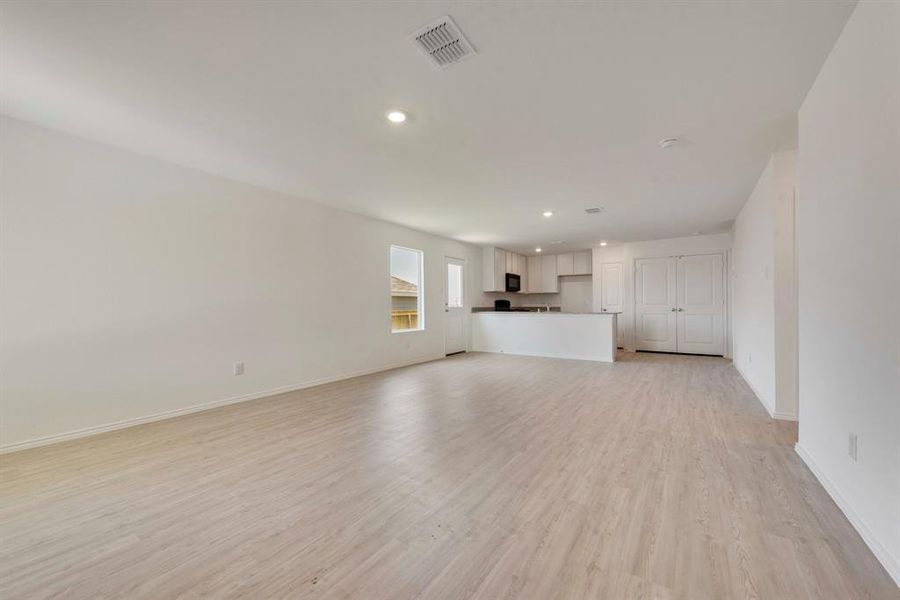 Unfurnished living room featuring light hardwood / wood-style flooring