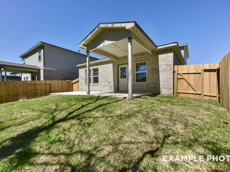 Exterior details and patio area of a home in Caney Creek Place, Conroe (Image 22).