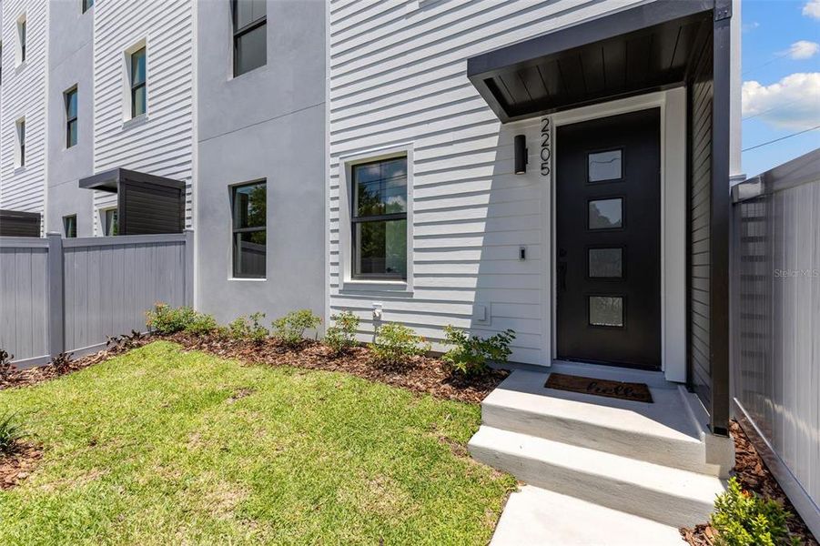 Front exterior of a new home in , St. Petersburg, FL, highlighting curb appeal (Image 19).