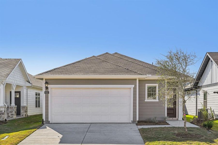 Front exterior of a new home in Trails of Lavon - Spring Series, Lavon, TX, highlighting curb appeal (Image 25).