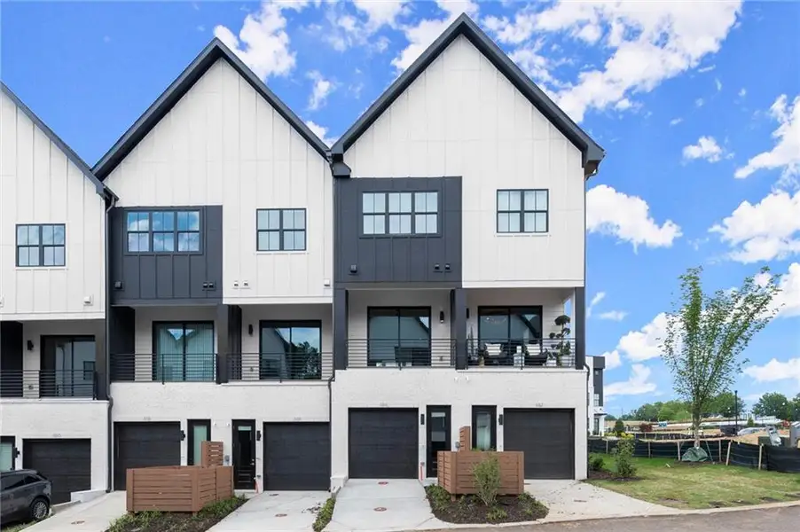 Front exterior of a new home in The Gathering – Alpharetta, Alpharetta, GA, highlighting curb appeal (Image 1). Front exterior of a new home in The Gathering – Alpharetta, Alpharetta, GA, highlighting curb appeal (Image 1).