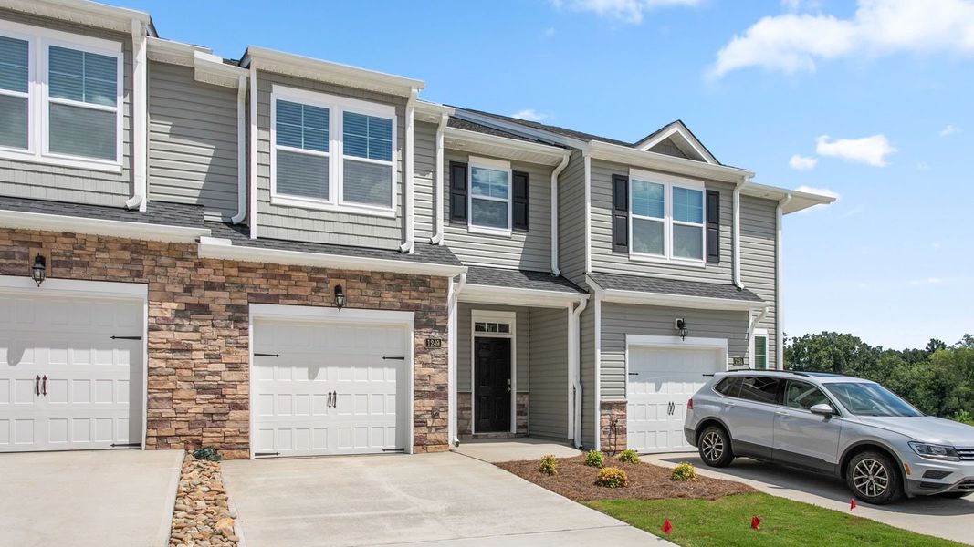 Front exterior of a new home in The Gables at Edinborough Townes, Gibsonville, NC, highlighting curb appeal (Image 2).