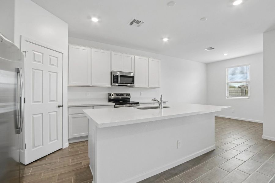 Kitchen and dining. Representative images and renderings are for illustrative purposes. Actual structural options and design finishes of home may vary. Kitchen and dining. Representative images and renderings are for illustrative purposes. Actual structural options and design finishes of home may vary.