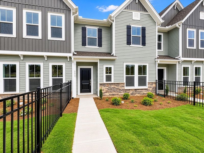 Front exterior of a new home in Westwood Reserve, Charlotte, NC, highlighting curb appeal (Image 2). Front exterior of a new home in Westwood Reserve, Charlotte, NC, highlighting curb appeal (Image 2).