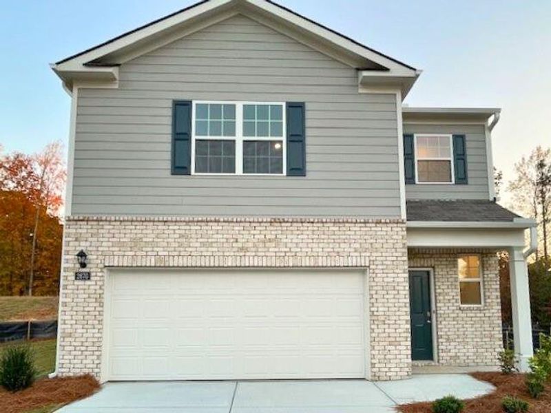Front exterior of a new home in Sherwood Manor, South Fulton, GA, highlighting curb appeal (Image 1).