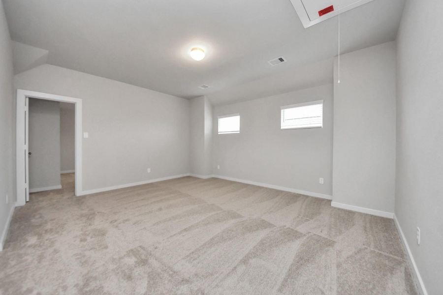 Ascend to relaxation in this fantastic game room! Ideal for both casual gatherings and adultgaming, it boasts plush carpet, lofty ceilings, custom paint, and ample windows for abundantnatural light. Sample photo of completed home with similar floor plan. Actual colors and selections may vary. Ascend to relaxation in this fantastic game room! Ideal for both casual gatherings and adultgaming, it boasts plush carpet, lofty ceilings, custom paint, and ample windows for abundantnatural light. Sample photo of completed home with similar floor plan. Actual colors and selections may vary.