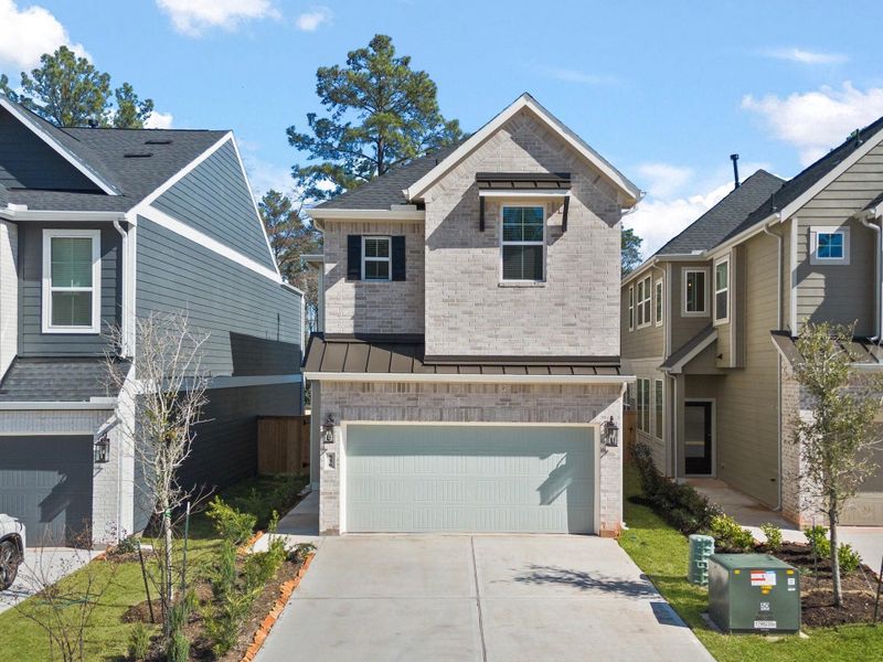Front exterior of a new home in The Woodlands Hills, Willis, TX, highlighting curb appeal (Image 1). Front exterior of a new home in The Woodlands Hills, Willis, TX, highlighting curb appeal (Image 1).