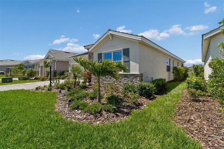 Front exterior of a new home in Star Farms at Lakewood Ranch, Bradenton, FL, highlighting curb appeal (Image 28).