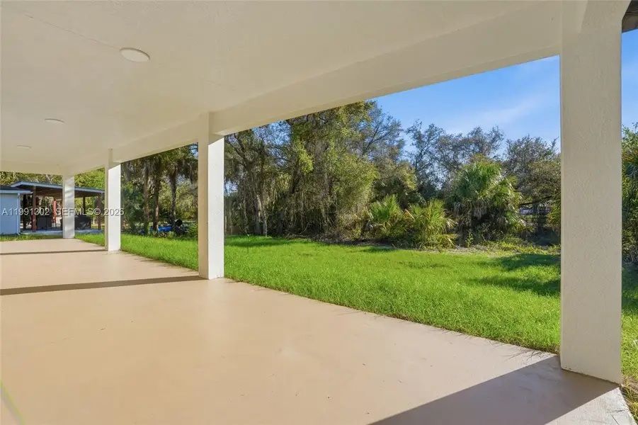 Exterior details and patio area of a home in , Labelle (Image 26).