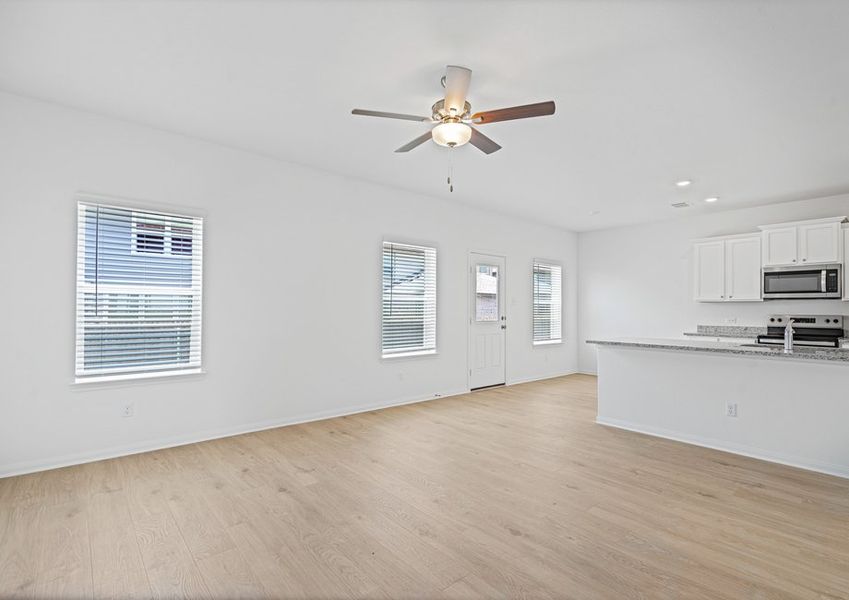 The family room and adjoining kitchen and dining room