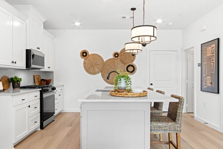 Representative furnished interior of a home built from the Birch (RE) by Grenadier Homes in Wildridge, Oak Point (Image 3).