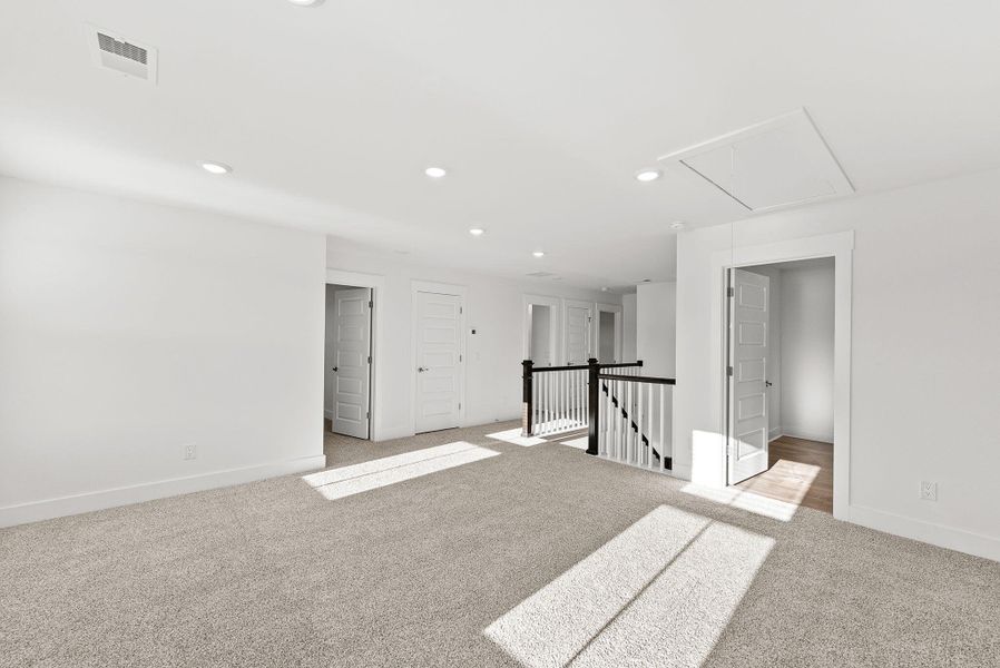 Spacious, unfurnished interior of a new home in The Coves at Lakes of Cane Bay, Summerville (Image 38). Spacious, unfurnished interior of a new home in The Coves at Lakes of Cane Bay, Summerville (Image 38).
