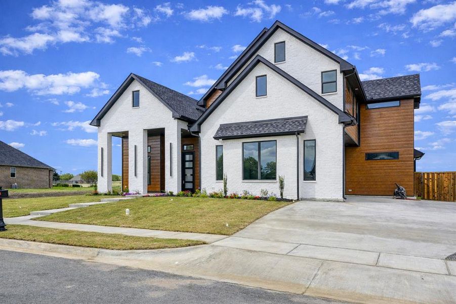 Front exterior of a new home in , Pottsboro, TX, highlighting curb appeal (Image 28).