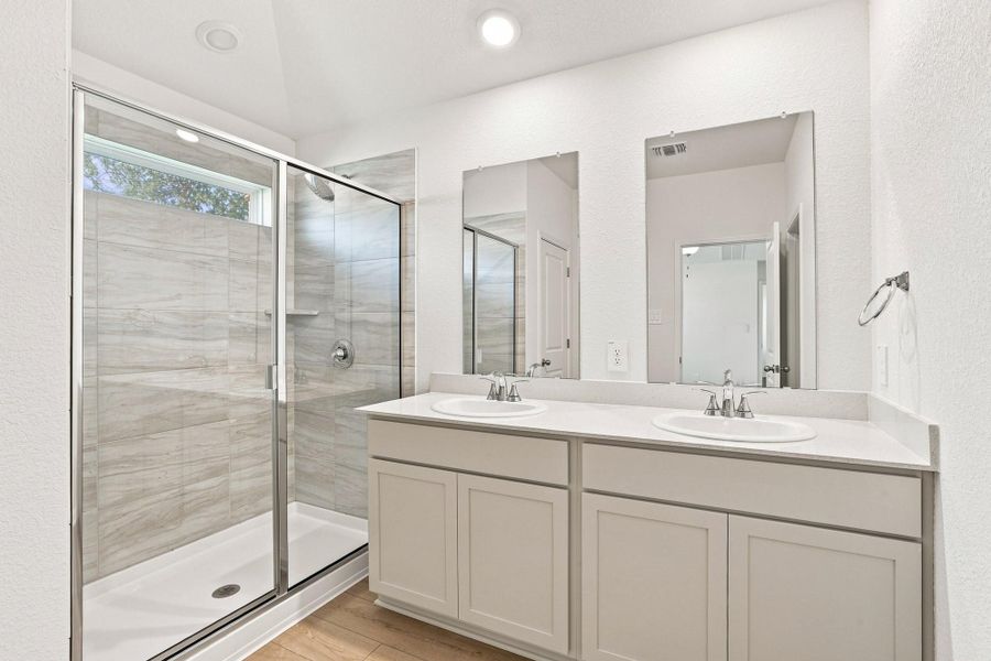 Clean lines and a spacious dual vanity highlight this contemporary bathroom design.