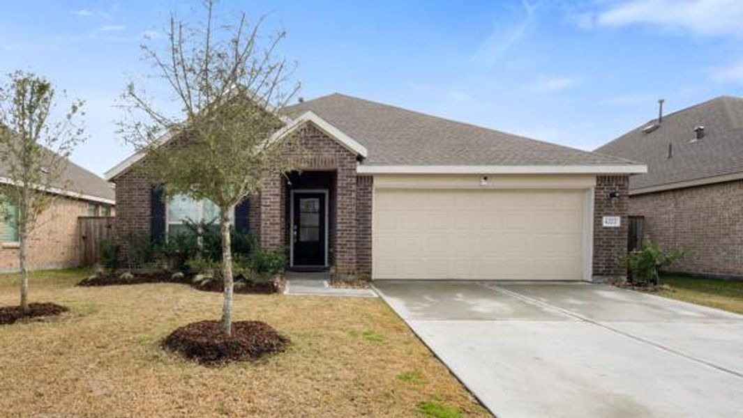 Front exterior of a new home in Sterling Point at Baytown Crossings: Wildflower II Collection, Baytown, TX, highlighting curb appeal (Image 1). Front exterior of a new home in Sterling Point at Baytown Crossings: Wildflower II Collection, Baytown, TX, highlighting curb appeal (Image 1).