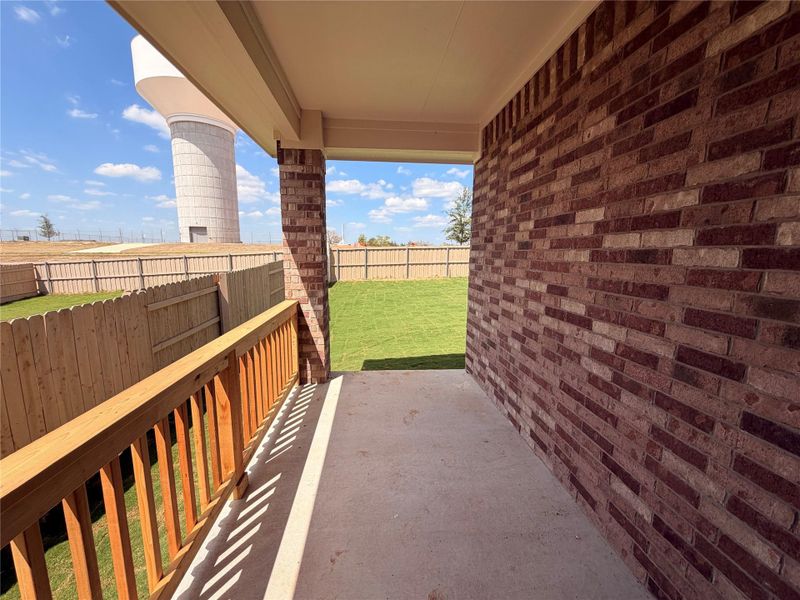 Exterior details and patio area of a home in The Colony, Bastrop (Image 12).