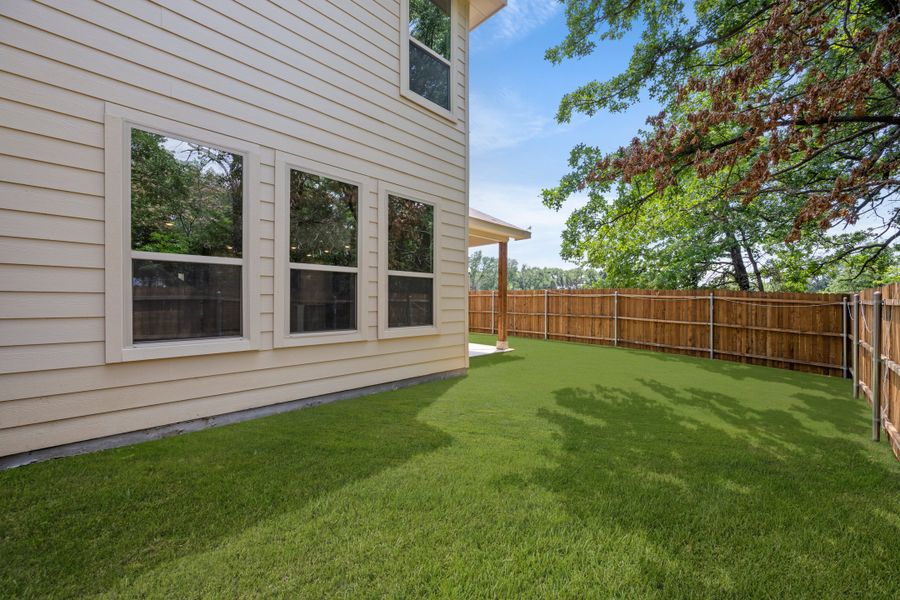 Front exterior of a new home in Eagle Cove, Denton, TX, highlighting curb appeal (Image 17). Front exterior of a new home in Eagle Cove, Denton, TX, highlighting curb appeal (Image 17).