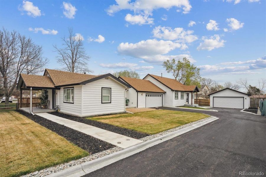 Front exterior of a new home in , Lakewood, CO, highlighting curb appeal (Image 20).
