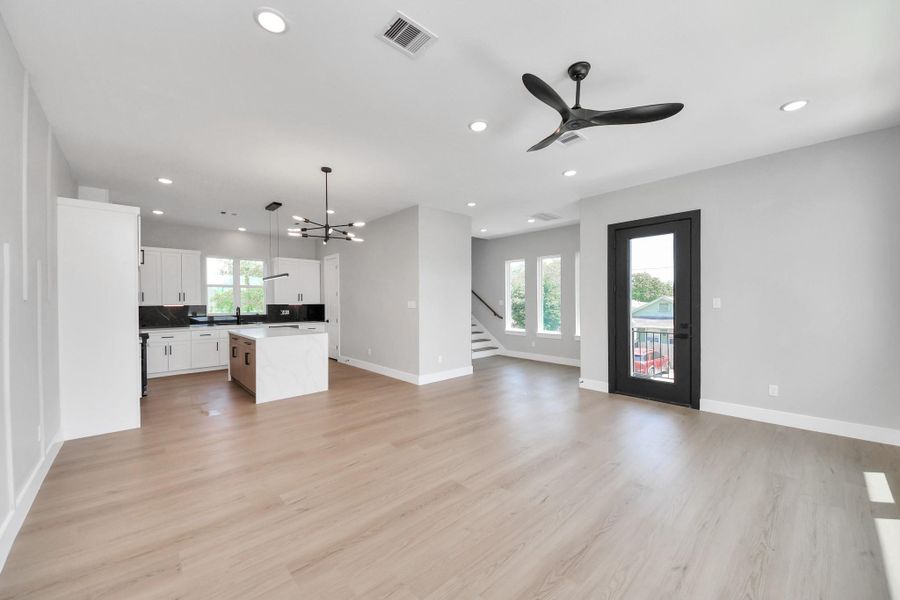 Open-concept living & dining space with designer lighting, oversized windows, & warm modern finishes throughout. Thoughtfully designed for both comfortable living & effortless entertaining.