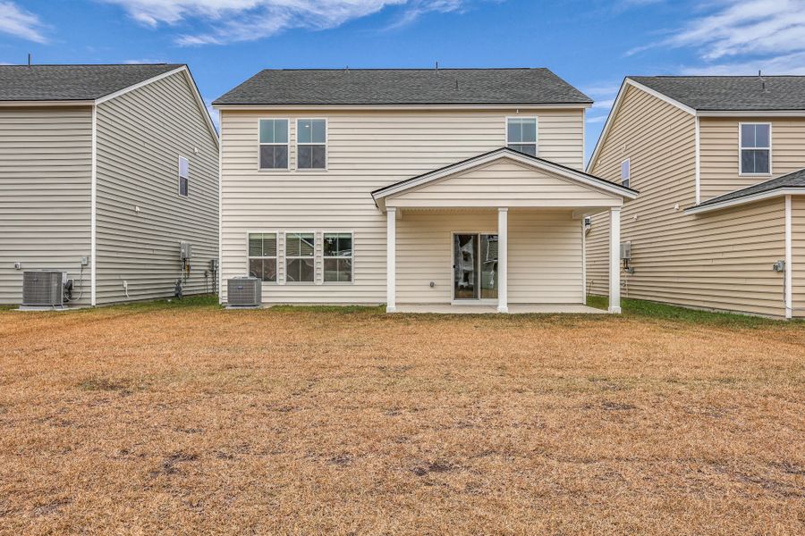 Exterior details and patio area of a home in Sweetgrass at Summers Corner: Carolina Collection, Summerville (Image 30).