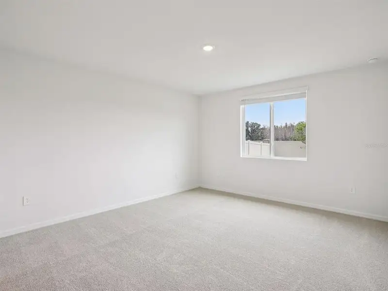 Spacious, unfurnished interior of a new home in The Grove at Stuart Crossing - Classic Series, Bartow (Image 19).