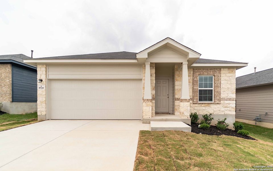Front exterior of a new home in Hickory Ridge, Elmendorf, TX, highlighting curb appeal (Image 1).