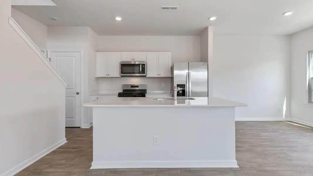 Furnished interior view inside a new home in The Townes at Matthews Landing, Fuquay Varina (Image 2). Furnished interior view inside a new home in The Townes at Matthews Landing, Fuquay Varina (Image 2).